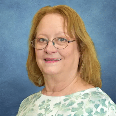 A professional headshot of Terri Barrada, APRN, at Healthy Connections.
