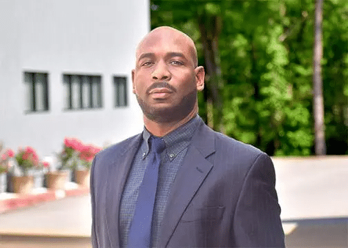 A professional headshot of Eric Luster, APRN PMHNP, at Healthy Connections.