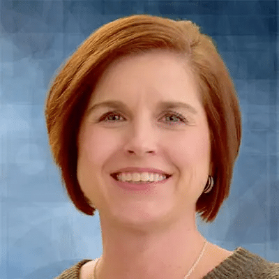 A professional headshot of Melanie Newman, APRN, at Healthy Connections.