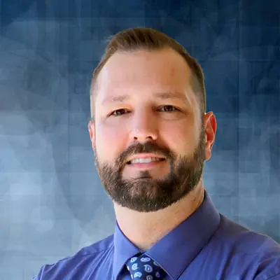 A professional headshot of Matthew Huskey, APRN, at Healthy Connections.