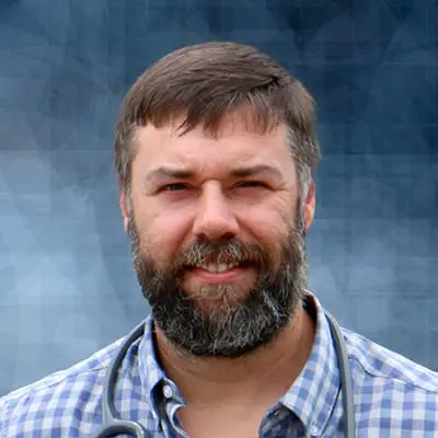 A professional headshot of Clay McDowell, APRN, at Healthy Connections.