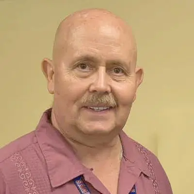 A professional headshot of Lonnie Sessler, MD, at Healthy Connections.